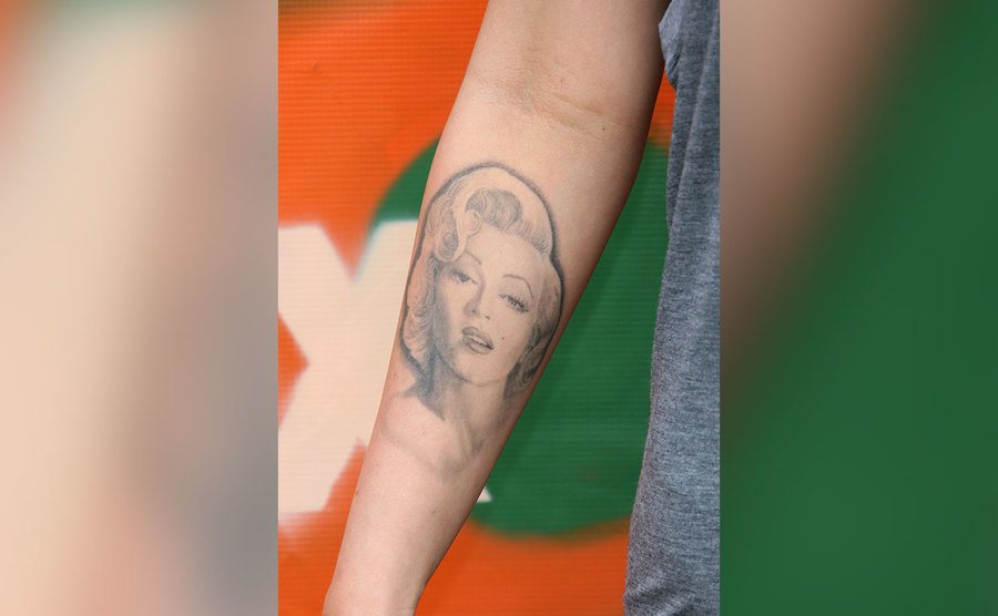 A closeup of the Marilyn Monroe tattoo on the forearm of Megan Fox.