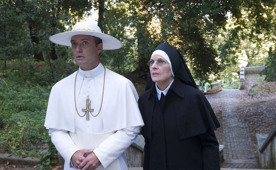 Jude Law and Diane Keaton walk through the Vatican gardens. 