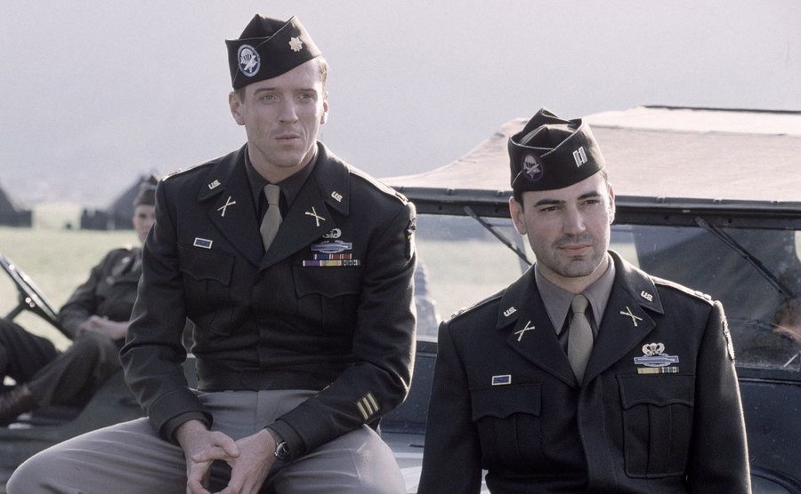 Damian Lewis and Ron Livingston dressed in army uniforms in a still from the show. 