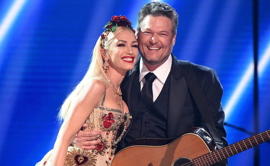 Gwen Stefani and Blake Shelton pose onstage during the 62nd GRAMMY Awards. 
