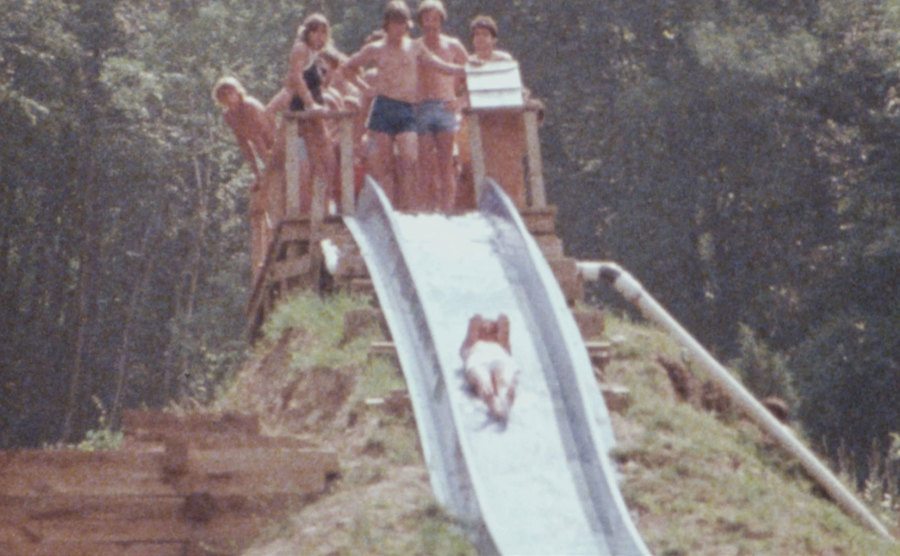 A picture of visitors waiting in line for a water slide.