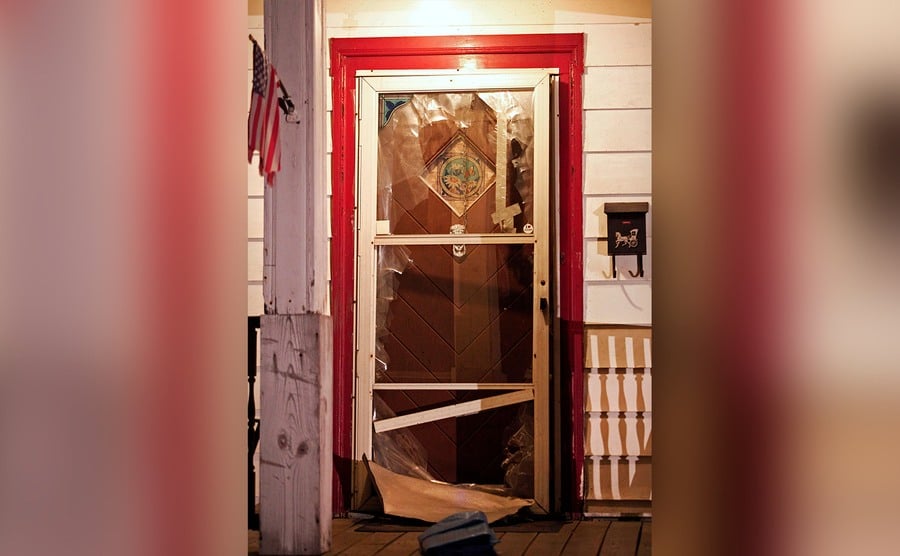 The smashed front door of the house where Ariel Castro lived. 