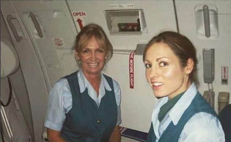 Becky poses with another woman as a flight attendant. 