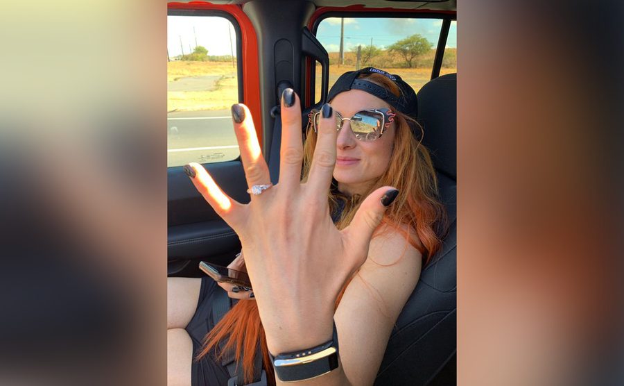 Becky Lynch shows off her engagement ring. 