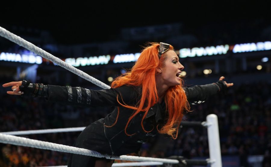Becky is laughing in the ring. 