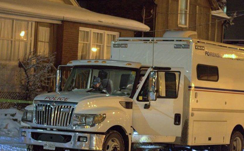 An image of a forensics vehicle parked outside Adam’s house.