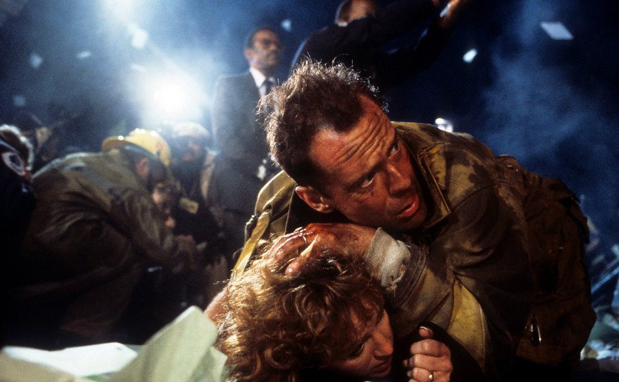 Bruce Willis holds down Bonnie Bedelia in a scene from the film.