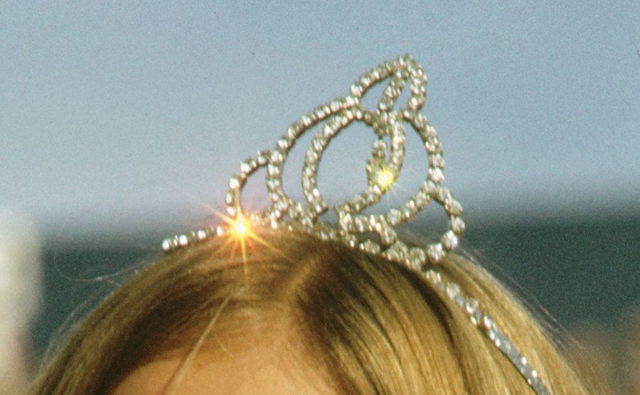 An image of a young girl wearing a tiara.