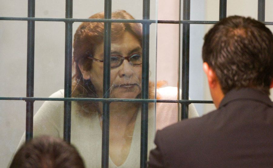 A photo of Juana behind bars.