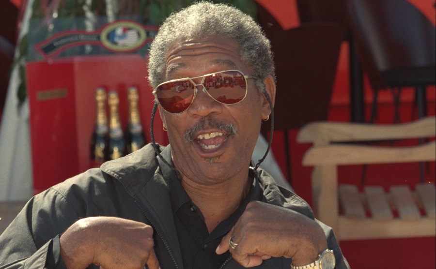 A picture of Morgan Freeman making a funny gesture.