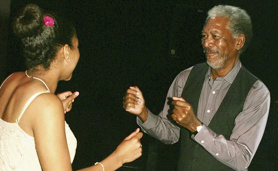Freeman dances with his granddaughter at an after-party.