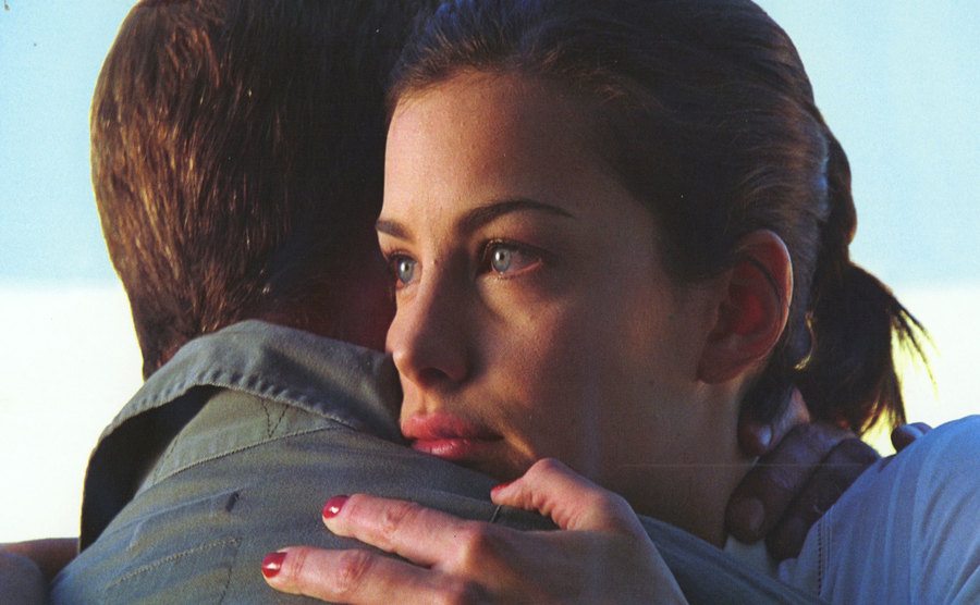 Liv Tyler embraces Ben Affleck in a movie still.