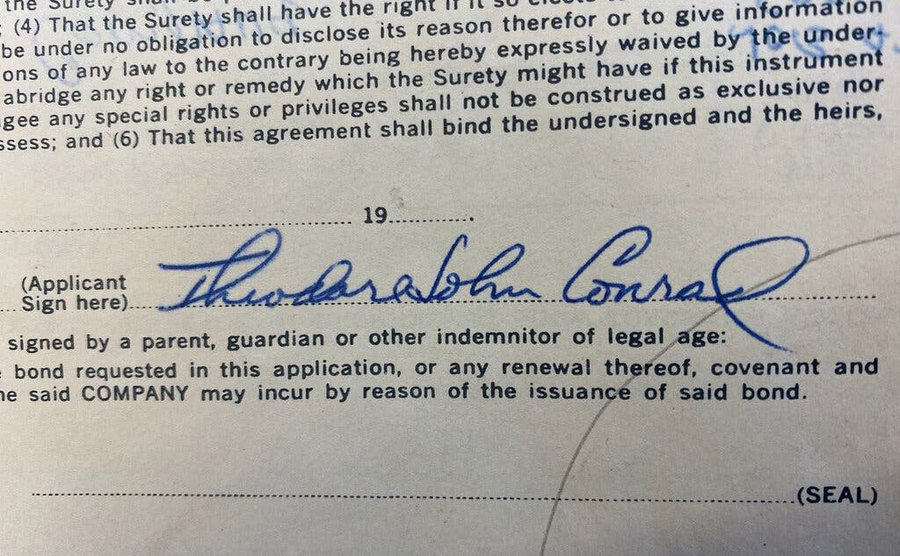A photo of a document signed by Conrad.