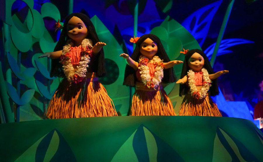 A photo of dolls in costume on It’s a Small World ride.