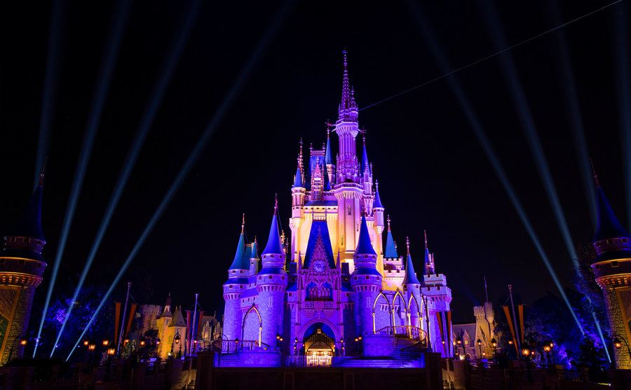 An exterior shot of Cinderella’s Castle at night.