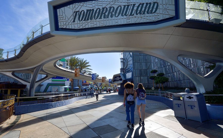 A photo of visitors walking into Tomorrowland.