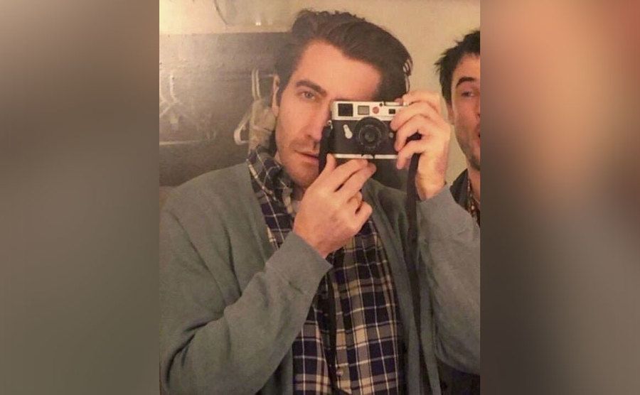 Gyllenhaal takes a picture of himself in the mirror. 