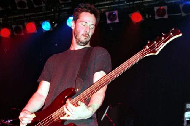 Keanu reeves playing the guitar