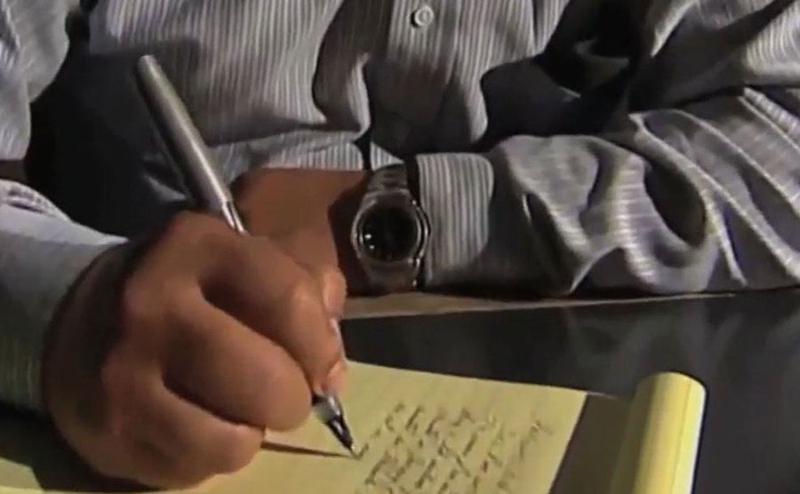 An image of an attorney taking notes.