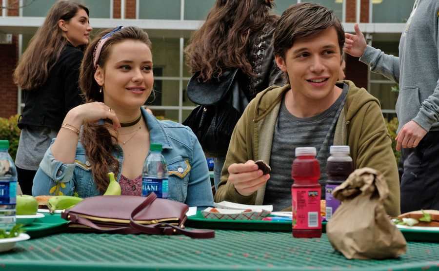 Katherine Langford and Nick Robinson share a lunch at school. 
