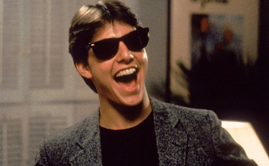 Tom Cruise flashes his dashing smile. 