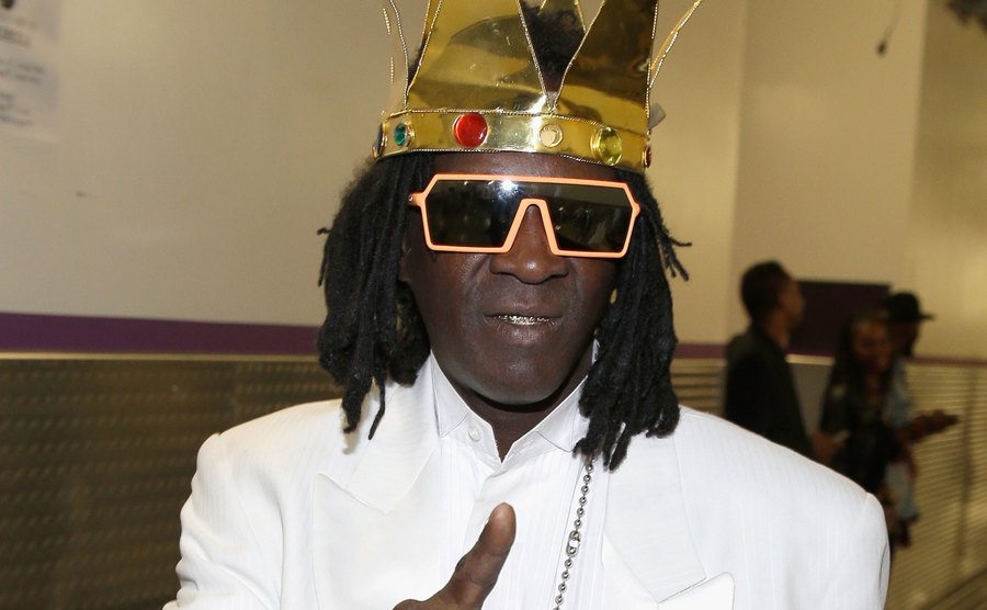 A backstage photo of Flavor Flav.