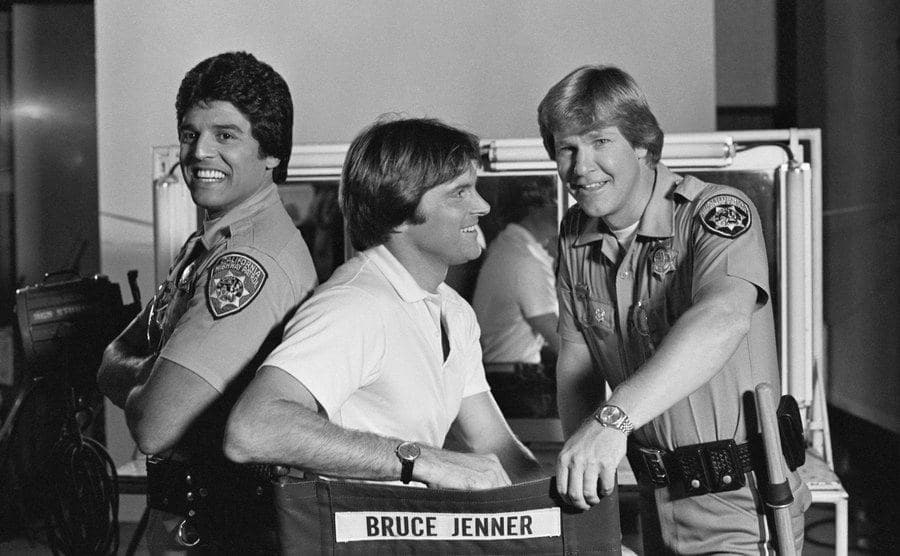 A dated picture of Estrada, Jenner, and Wilcox on set.