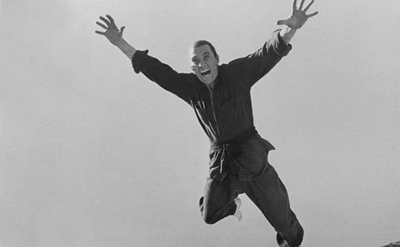 A still of Carradine in an action scene from Kung Fu.