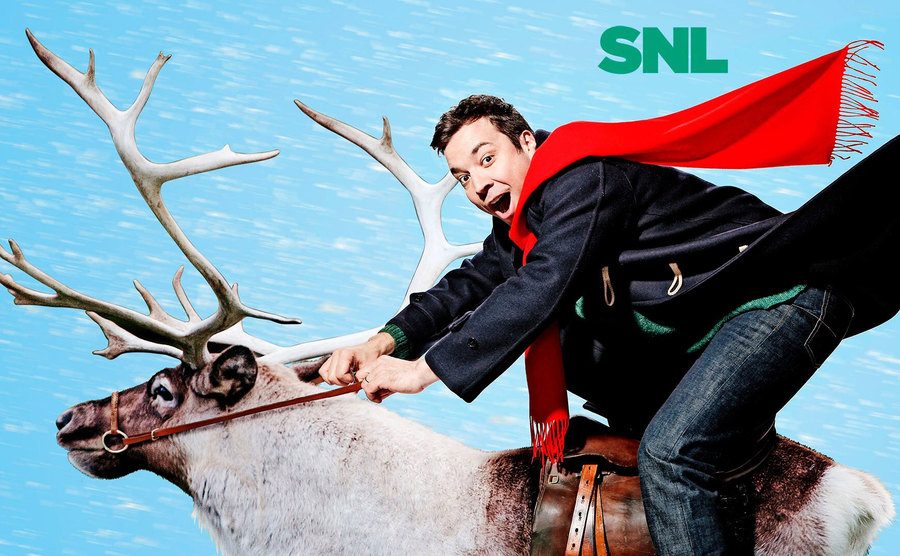 Jimmy Fallon rides a reindeer in a promo shot for SNL. 