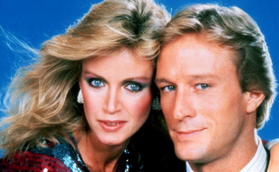 A portrait of Donna Mills and Ted Shackelford. 