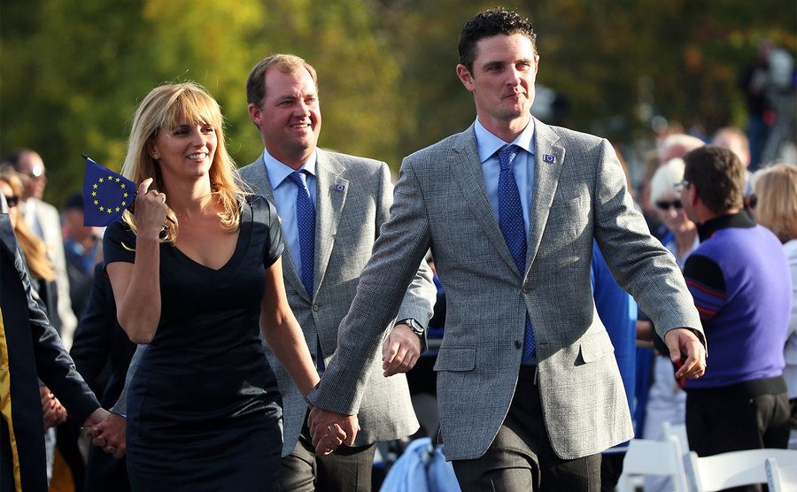 Justin Rose walks with his wife Kate to the stage at the Opening Ceremony for the 39th Ryder Cup.