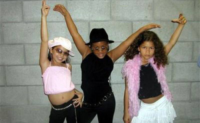 Zendaya and her friends strike a pose as young girls. 