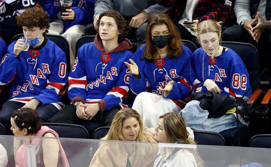Tom and Zendaya are at the Ranger game. 