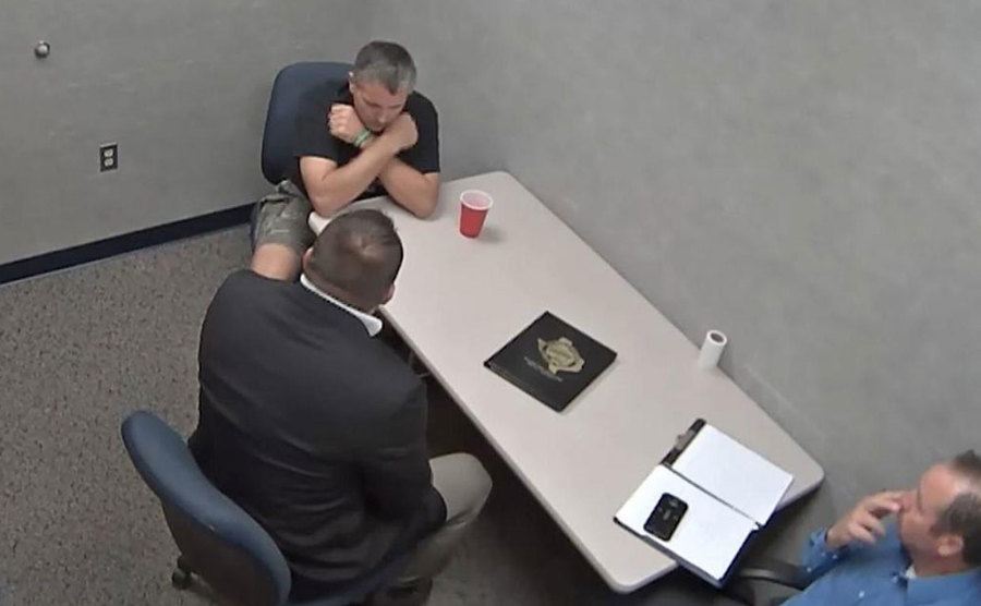 A surveillance tape of Todd in the interrogation room.