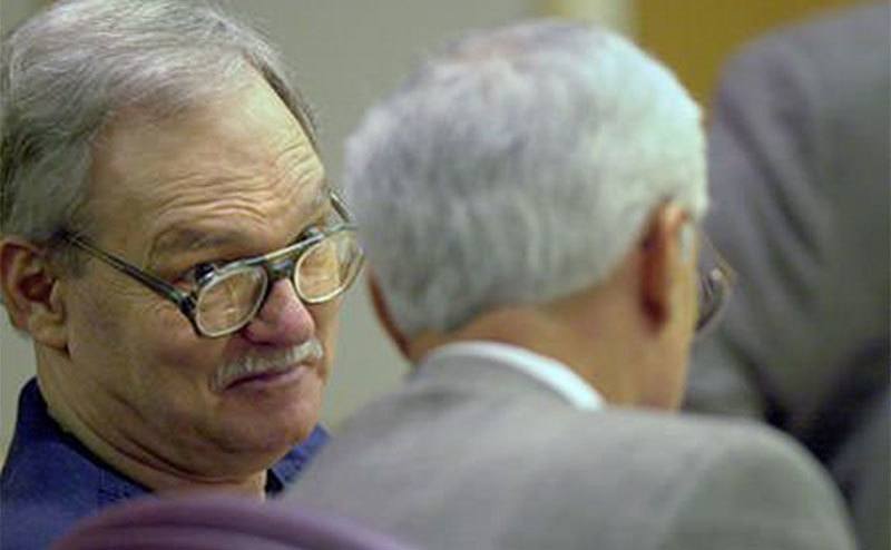 A photo of Floyd talking to his attorney during his trial.
