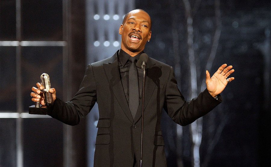 Eddie Murphy speaks onstage at the First Annual Comedy Awards. 