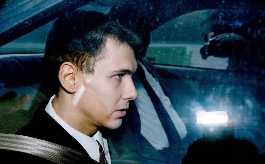 A photo of Paul Bernardo inside a police car.