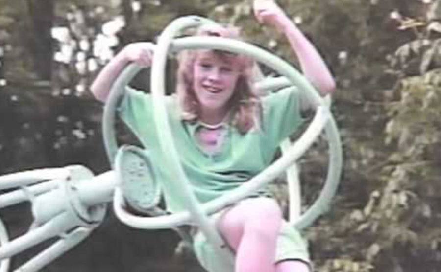 A dated picture of Leslie playing in a park.