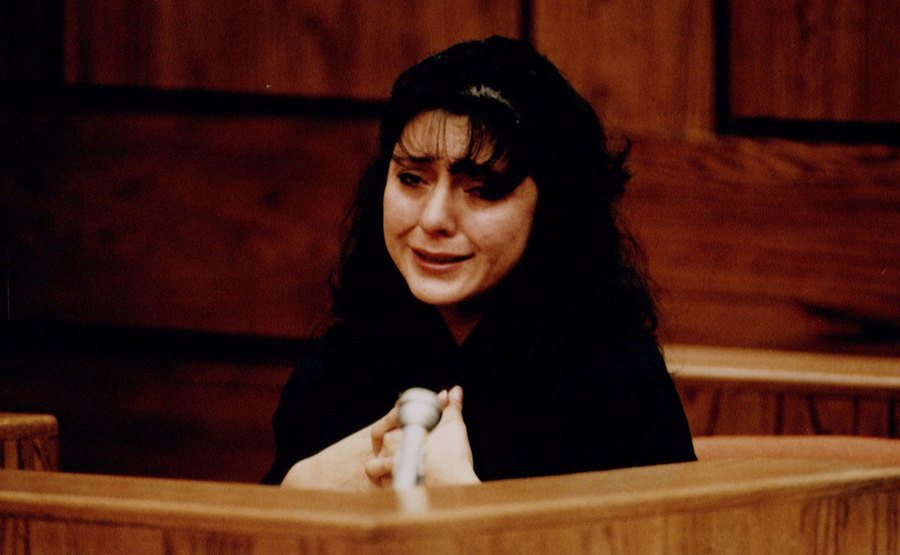 A photo of Lorena crying as she testifies in the stand.