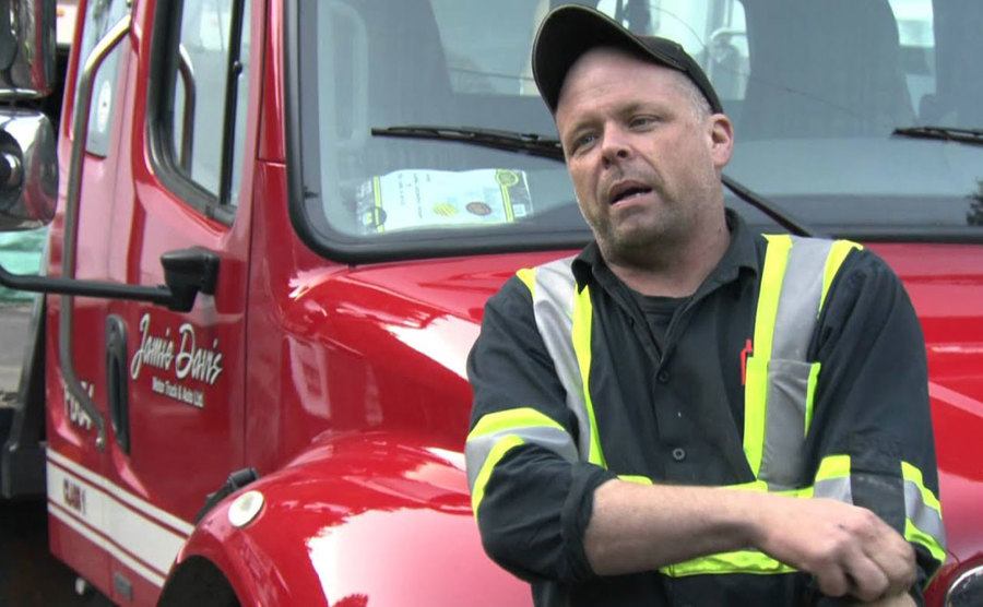 A still of a truck driver speaking in an episode from the show.
