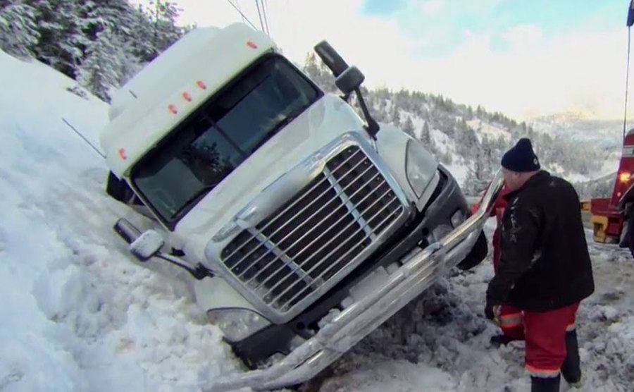A still of a truck stuck in the snow in an episode from the show.