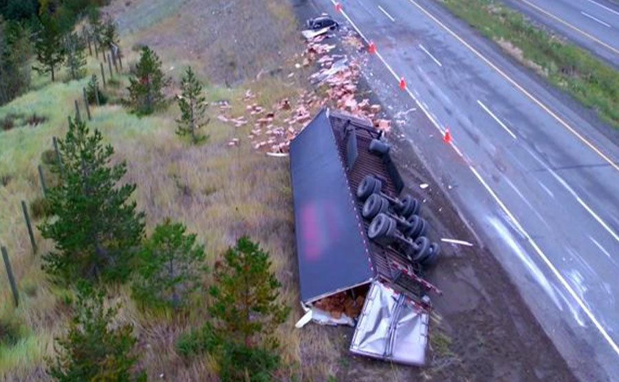 A still of a wrecked and turned around truck in Highway Thru Hell.