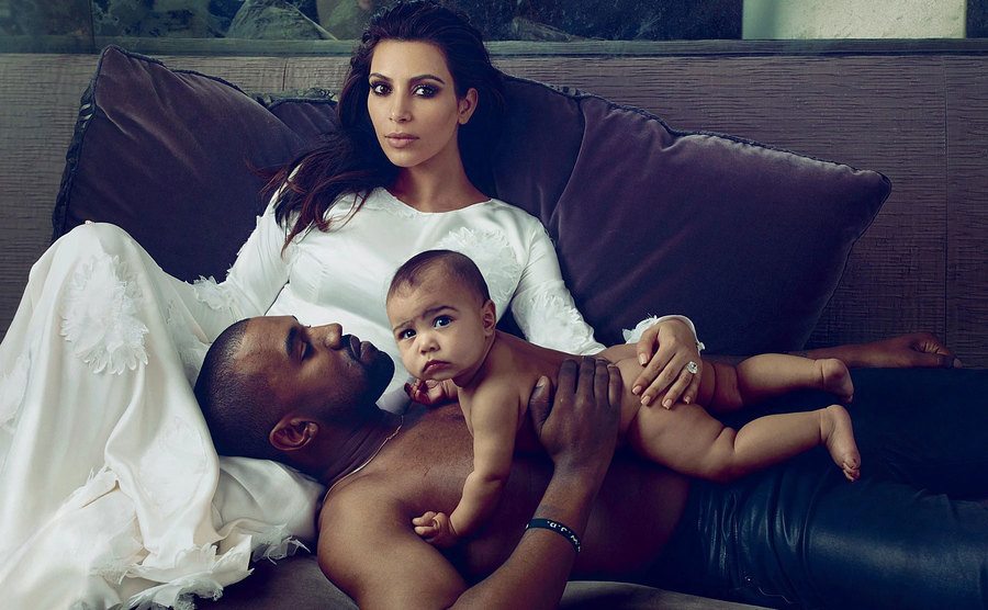Kim, Kanye, and baby North pose at home. 