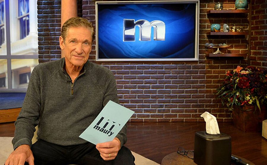 A photo of Maury Povich behind the scenes.
