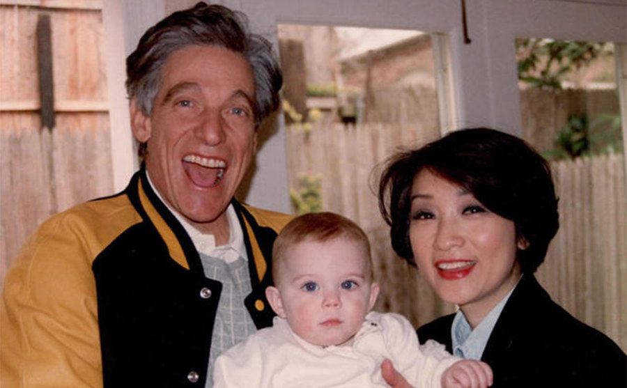 A dated picture of Maury and Connie with one of their children as a newborn.