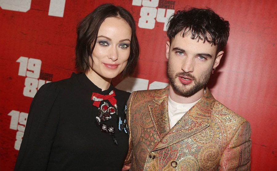 Olivia Wilde and Tom Sturridge pose at the opening night party for 