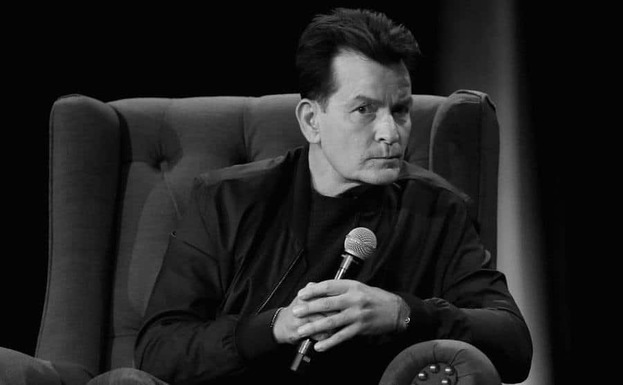 A photo of Charlie Sheen speaking on stage.