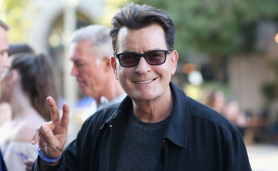 A photo of Charlie Sheen walking the street.