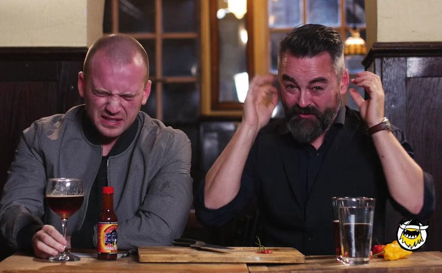 Sean Evans and Chili Klaus get red after eating the Carilina Reaper. 