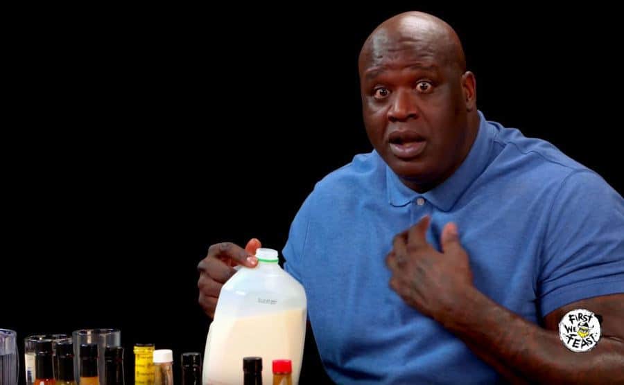 Shaquille O'Neal starts to tear up during his time on Hot Ones. 